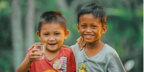 happy kids with glass of water