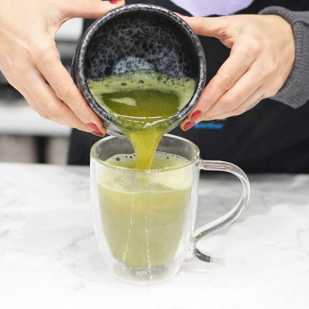 Pour-whisked-matcha-into-grosche-cyprus-double-walled-glass-mug