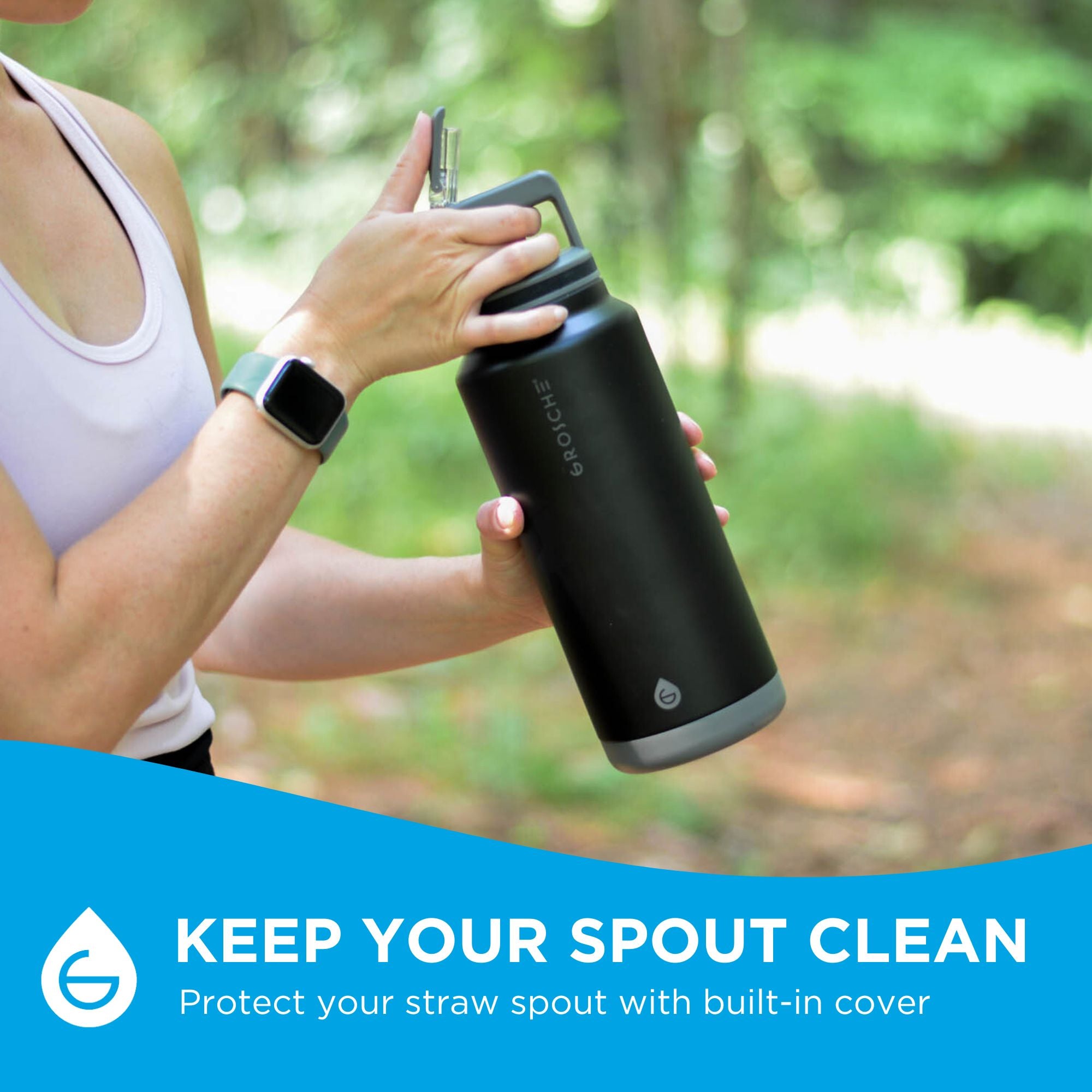 A woman holding the ALPINE 40oz large insulated water bottle on a hiking trail. Keep your straw clean with with the Flip N Sip built-in cover.