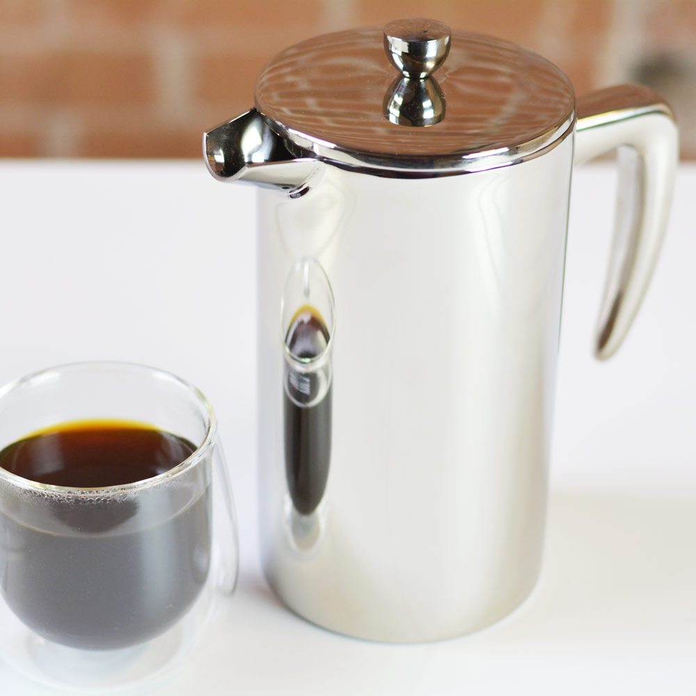 grosche-Dublin-double-walled-stainless-steel-french-press-with-coffee-cup-on-white-table