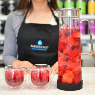BALI-water-infuser-pitcher-GR-267-and-Fresno-cups-with-handle-335-with-red-infused-tea-drink-on-counter