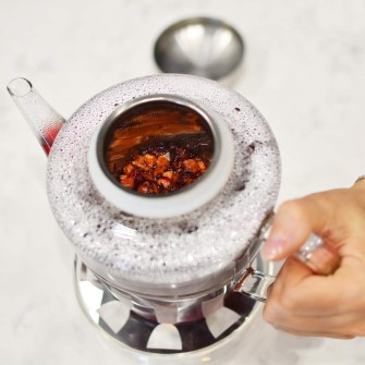 Sicily-teapot-and-sahara-warmer-with-red-tea-from-above-lid-removed-GROSCHE
