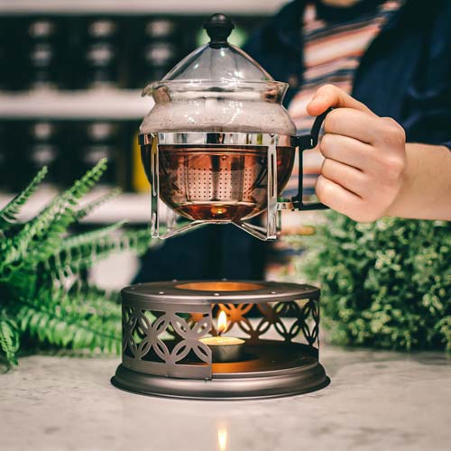 GROSCHE cairo teapot and food dish warmer placing teaapot on tealight candle