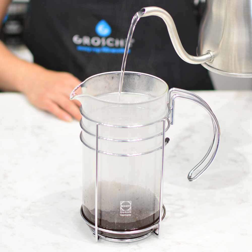 adding-water-to-a-grosche-madrid-french-press-closeup-to-make-coffee
