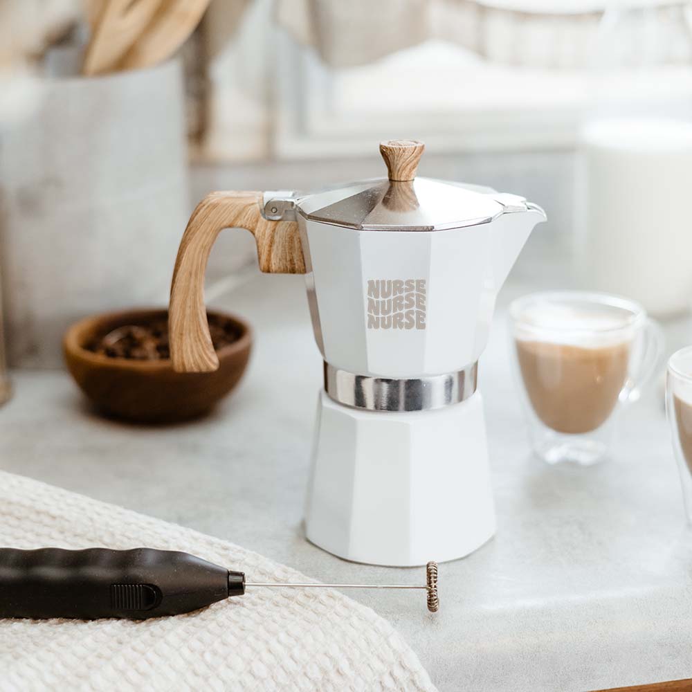 A photo of a moka pot with "nurse" custom etched with a groovy font. This is a great gift for registered nurses in your life.