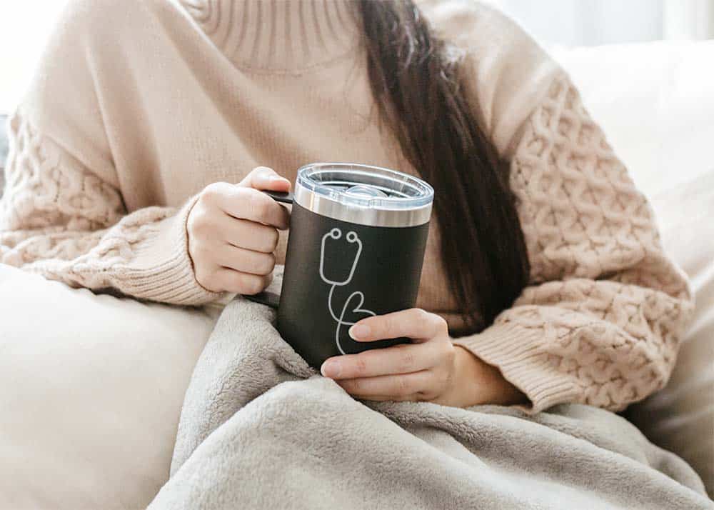 This photo features someone holding a custom etched stethoscope mug. This is a great gift for doctors or nurses.